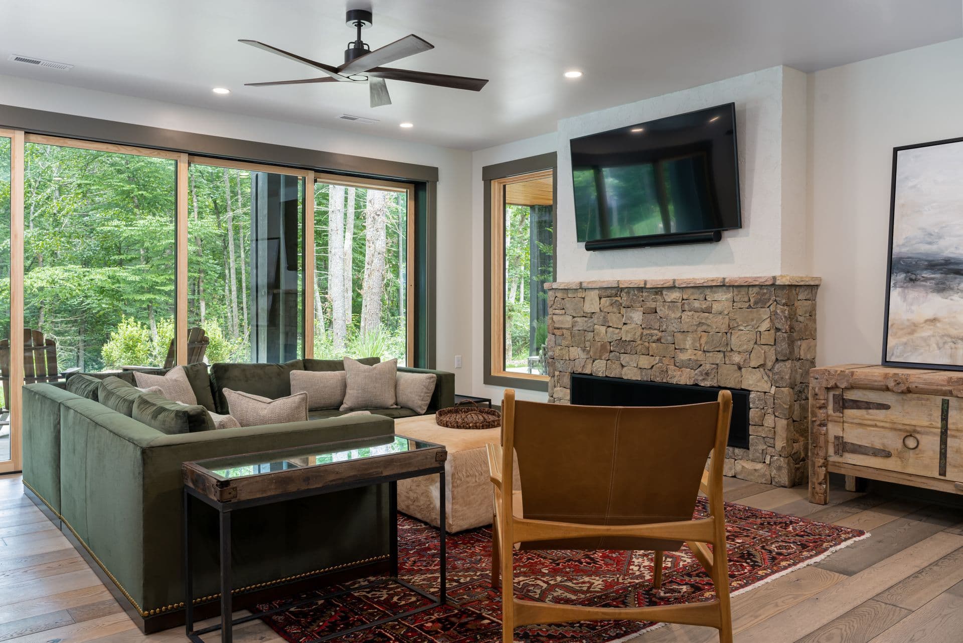Comfortable family sitting room with a stone fireplace