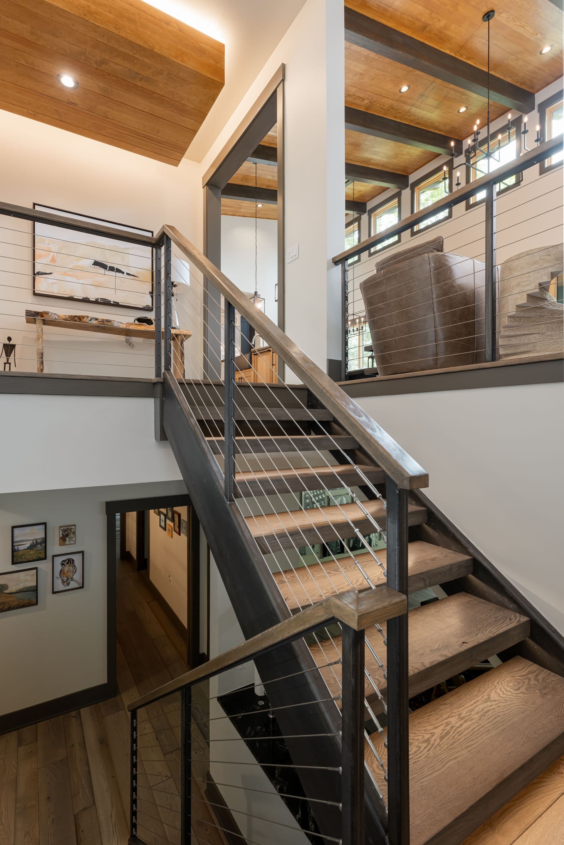 Open staircase and upper landing with dark metal railings