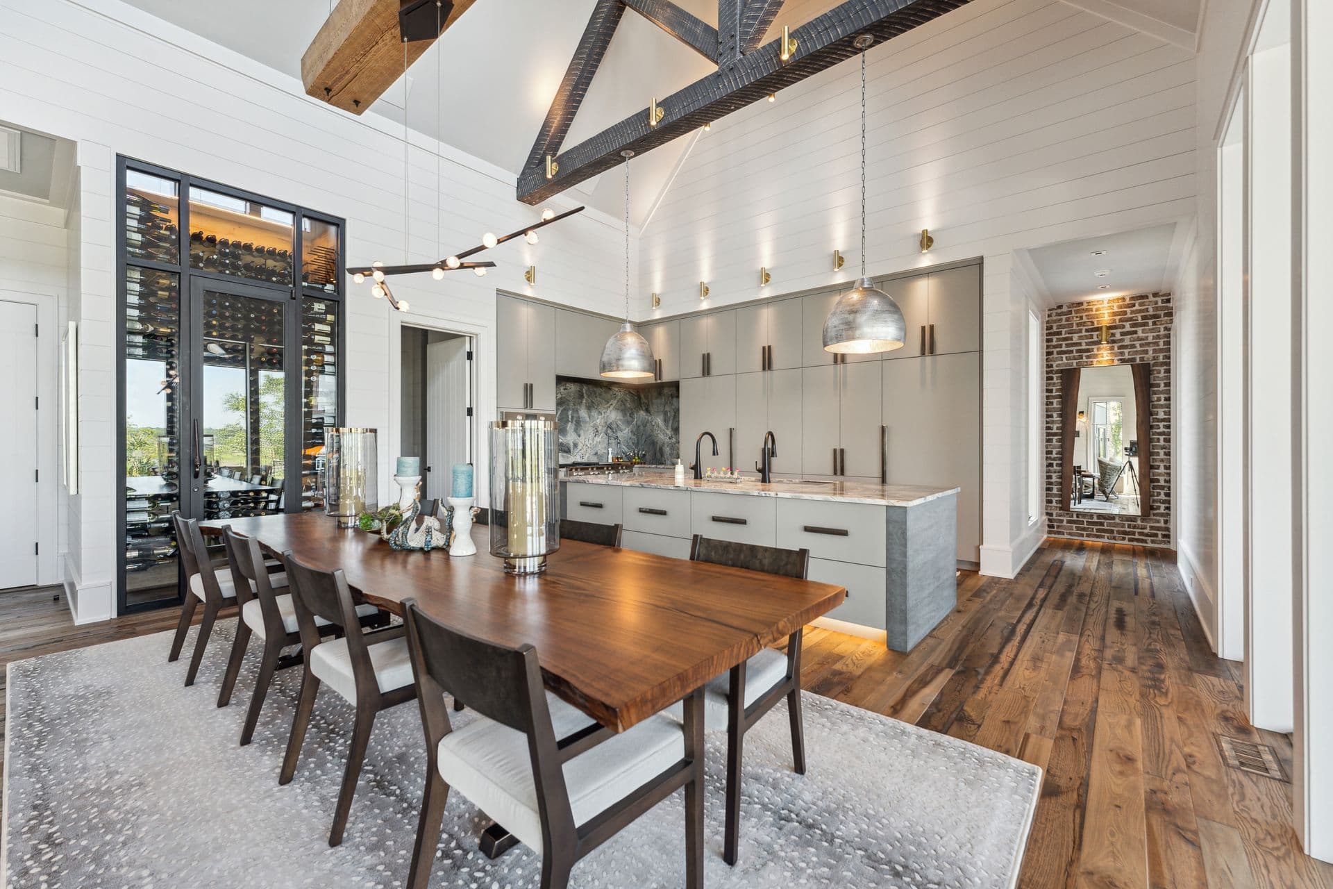 Island home dining room with a long timber table