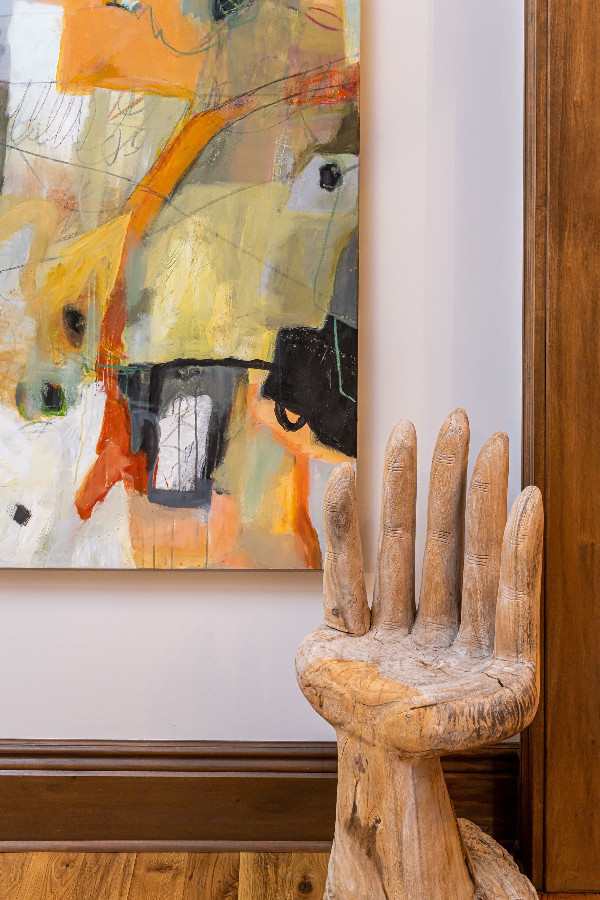 Colorful artwork and collected accents in the living room