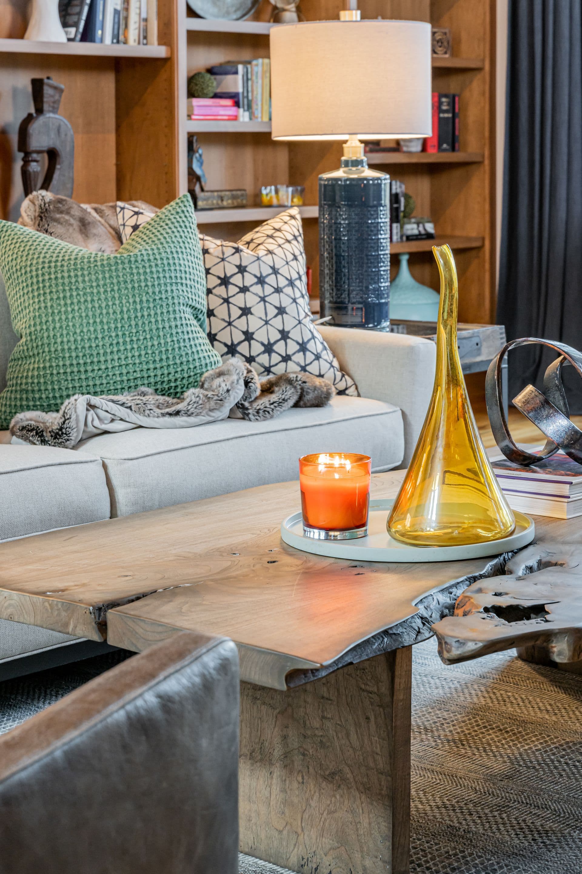 Sitting area layered with vibrant textiles and natural textures