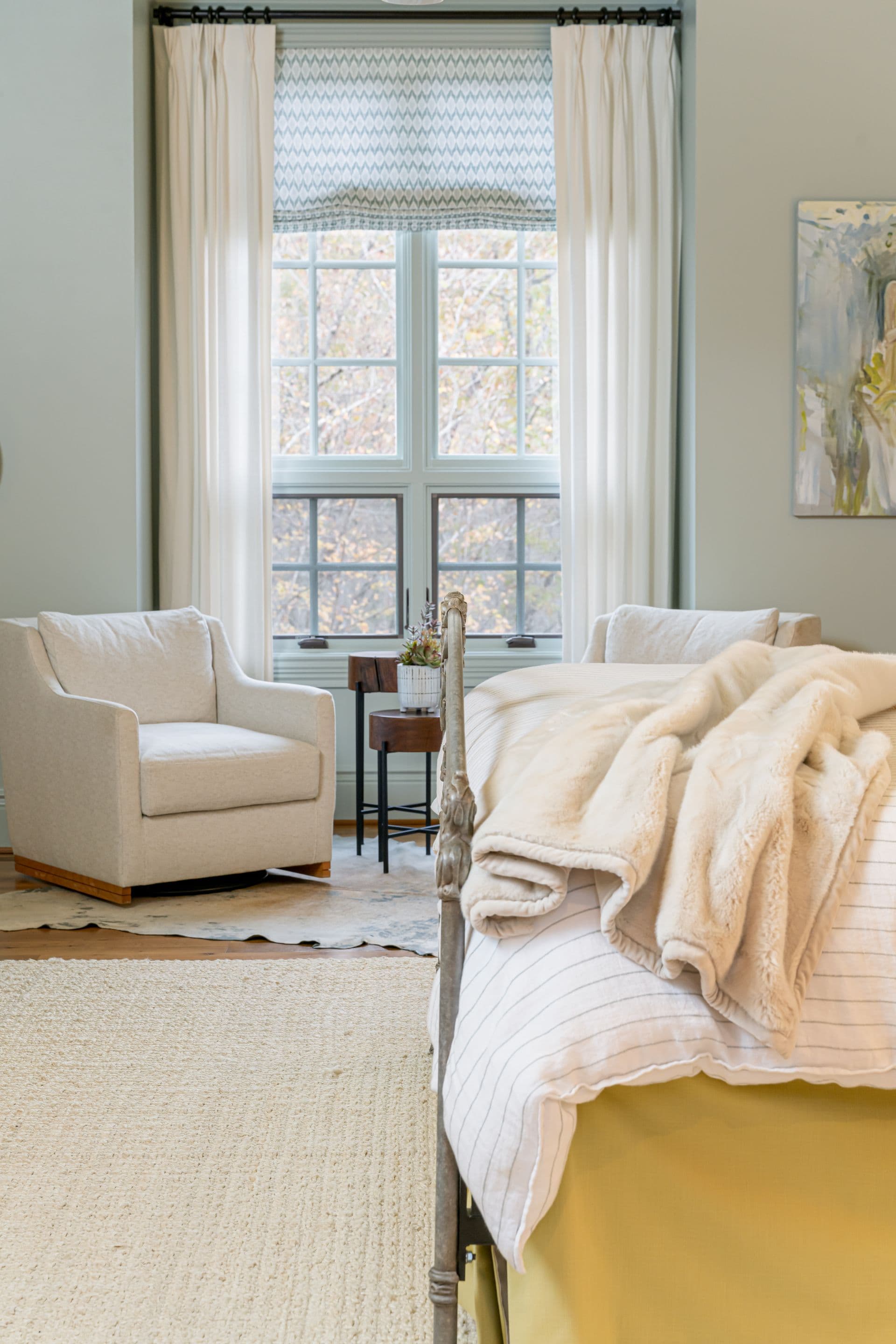 Light-filled bedroom with soft layered linens