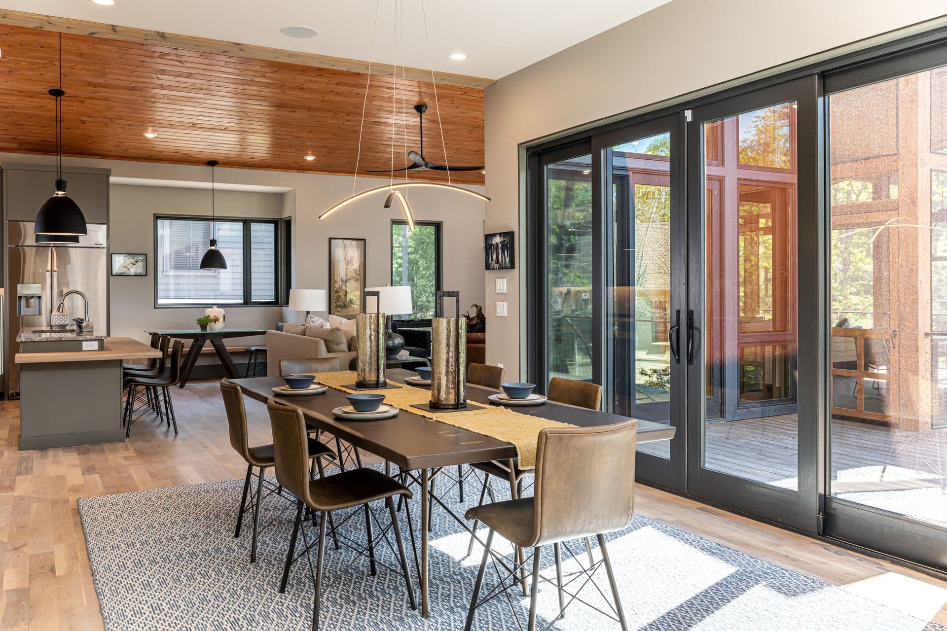 Open dining room and kitchen with natural wood finishes