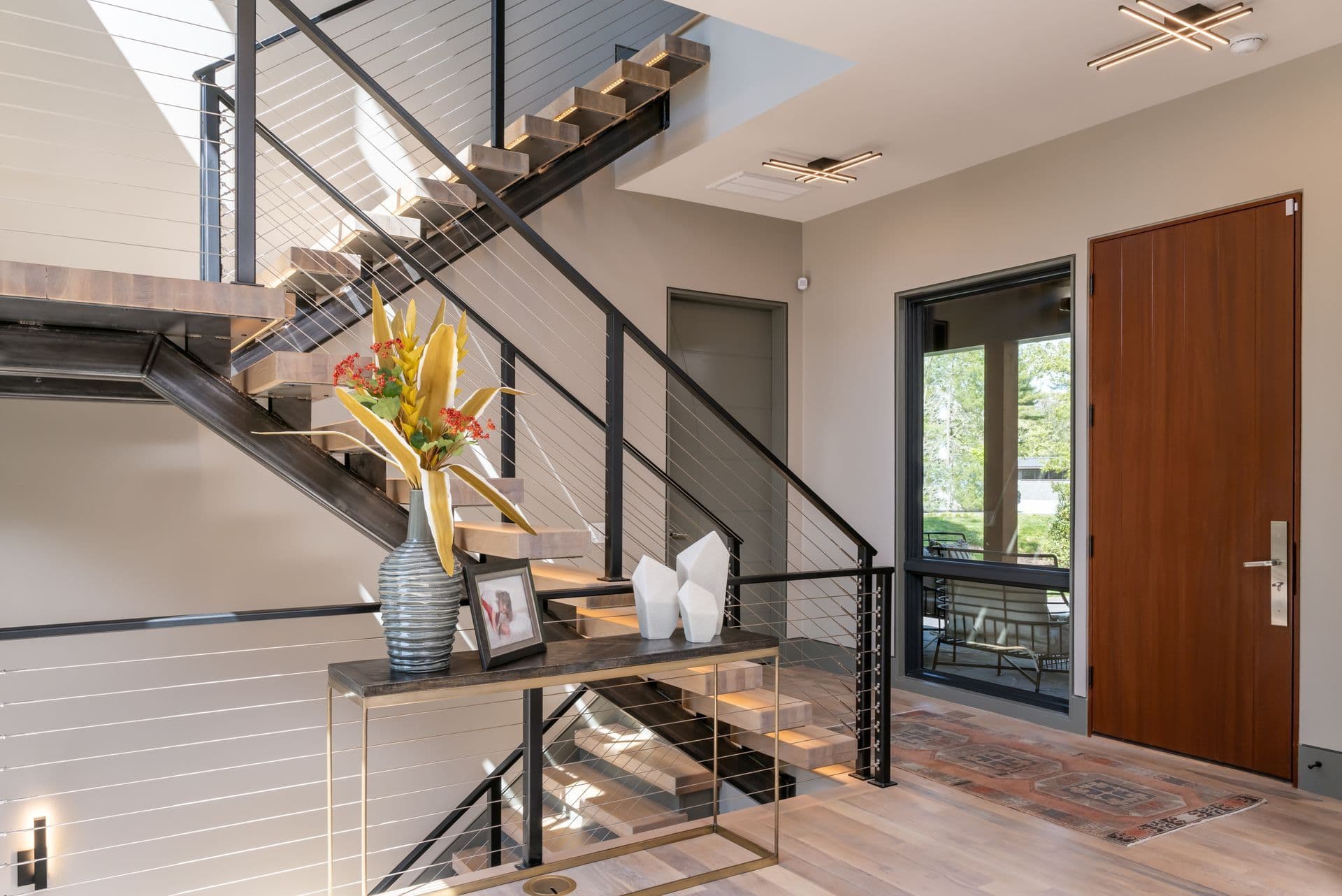 Entry hall with a staircase and warm wood details