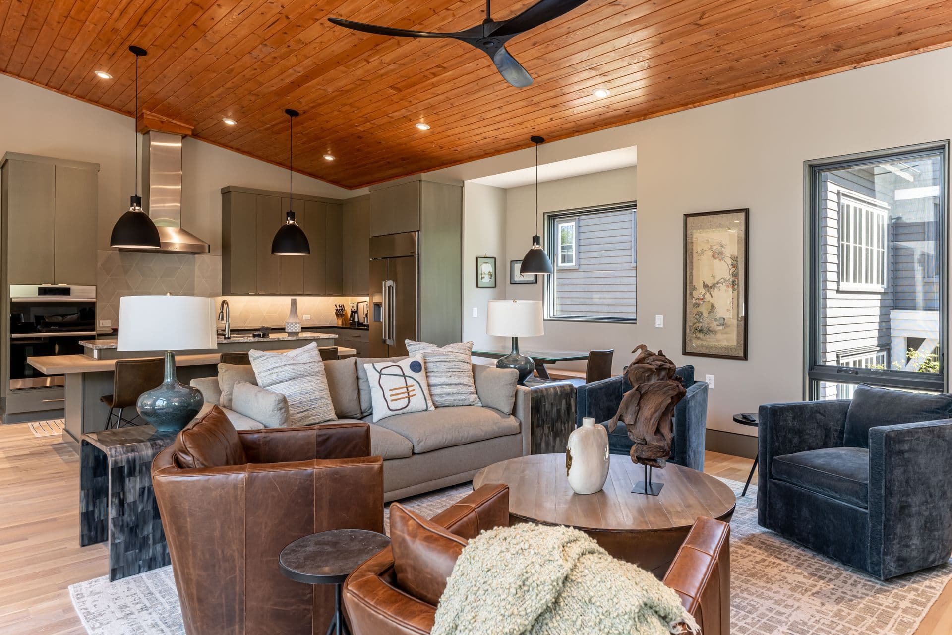 Living room connected to a light-filled kitchen